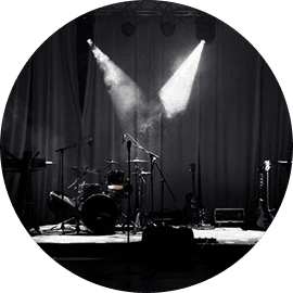 Empty stage with instruments and spotlight.
